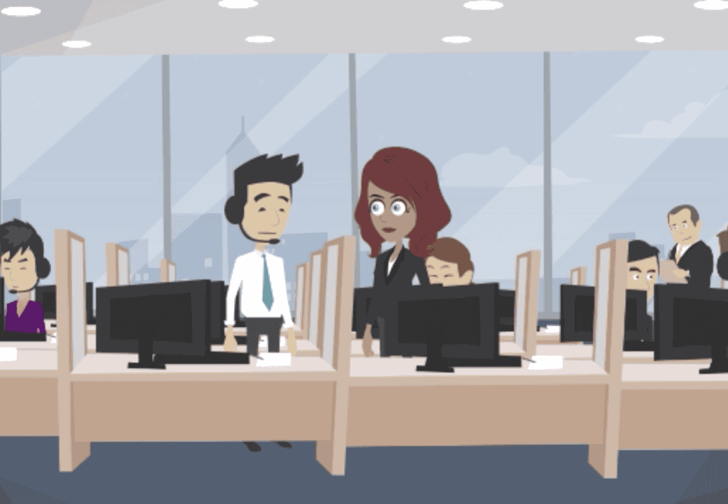 Cartoon office scene with several people working at desks with computers. A man wearing a headset talks to a woman standing beside him. Other employees work in the background. Large windows show a cityscape outside.